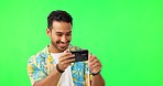 Vacation, phone and picture with a man and green screen taking a photo for social media. Isolated, studio background and male model with mobile and holiday photo for networking with a happy smile