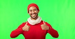 Green screen, face and happy man with thumbs up for winter sale, fashion and good news on studio background. Portrait, review and asian male with finger emoji for positive review, vote or yes sign