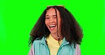 Young woman, wink and face with green screen and studio feeling happy and funny. Gen z, fashion and emoji, fun and flirty winking for comedy and comic joke with confidence and happiness with beauty