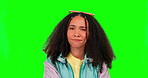 Idea, doubt and green screen with a black woman thinking while looking uncertain about a choice or decision. Portrait, confused or contemplating with an attractive young female model in retro clothes