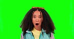 Shock, wow and face of a woman on a green screen isolated on a studio background. Surprise, reaction and portrait of a young person hearing or listening to bad news, an announcement or gossip