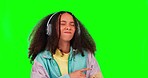 Rock, green screen and woman with headphones, dancing and stress relief against a studio background. Female person, dancer and model with a headset, streaming music and confidence with radio or audio