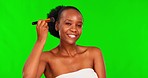 Cosmetics, makeup and black woman with brush on green screen for facial beauty, skincare and happiness. Skin care, smile and happy model with make up tools for cosmetic application tutorial for women