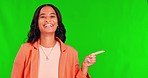 Business woman face, green screen and pointing to deal and product placement choice. Happy, female employee portrait and chromakey background with mockup and announcement for promotion coming soon