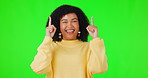 Happy woman, pointing up and green screen for advertising, announcement or promotion. Face and hands of excited african female person smile on studio background for mockup space, sale or notification