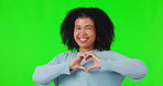 Heart, portrait of woman with hand and against a green screen for support. Thank you or love, kindness or peace and happy female person with emoji sign for wellness or care against a chroma key