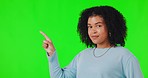 Woman, pointing finger and green screen for advertising space, announcement or promotion. Face and hands of african female person on studio background for mockup, sale and deal or choice list