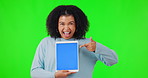 Woman, tablet and excited for mockup on green screen while pointing finger for wow deal or promotion. Portrait of African person with smile and hand for website sale, advertising and app review or ux