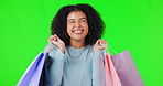 Woman, shopping bag and happy on green screen or sale, retail customer or fashion isolated in studio. Girl, shop and portrait of sales shopper with discount, promotion or gift bags on background