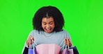 Happy, woman portrait and on green screen with shopping bag for purchase or isolated consumer and on mockup. Face, female shopper with smile and buying or gift or sale and on a studio background. 
