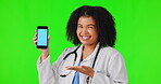 Face, woman and doctor with phone on green screen in studio isolated on a background. Smartphone, mockup portrait and African medical professional with marketing, happy space and tracking markers.