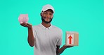 Courier, black man and choice between piggy bank and box in studio isolated on a blue background. Saving money, delivery and male person with package, decision for ecommerce budget and face portrait.