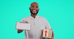 Portrait, delivery and contract with a black man courier in studio on a blue background holding a box. Logistics, ecommerce or package with a happy male postal worker giving a clipboard for signature