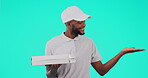 Man, hand and advertising logo space on studio green screen for pizza, delivery box or courier. Black person, product placement and information, marketing or mock up for promotion, branding or choice