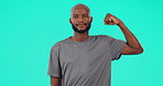 Portrait, strong and bicep with a black man in studio on a blue background for health or fitness. Muscle, arm and body with a handsome young male athlete posing indoor for exercise or training