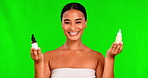 Green screen, happy woman and face with skincare choice of serum, oil product and makeup cosmetics on background. Portrait, female model and comparison of bottles for beauty, dermatology and decision
