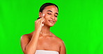 Happy woman, green screen and face roller for massage, aesthetic skincare and detox dermatology on studio background. Female model, crystal stone tools and facial beauty product of lymphatic drainage