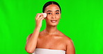 Green screen, woman and makeup sponge for face, cosmetics and aesthetic tools on studio background. Portrait, happy female model and facial beauty product to apply foundation, blend skincare and glow