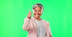 Business woman, portrait and thumbs up on green screen for success or good job against a studio background. Happy female person with smile showing thumb emoji, yes sign or like on chromakey mockup
