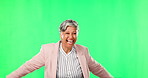 Dancing, green screen and senior woman blowing a kiss for happiness and doing happy dance in a studio background. Excited, winner and crazy elderly female person celebrating retirement with a smile
