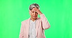 Anxiety, headache or mature businesswoman on green screen with burnout from mistakes, failures or fatigue. Migraine problem, studio or tired senior lady depressed or frustrated by head pain or stress