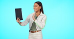 Technology, woman with tablet and waving against a blue background. Online communication or connectivity, social media or networking and female person on a video call against a studio backdrop