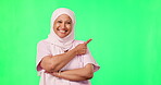 Green screen, pointing and nurse face isolated on studio background for islamic healthcare, mockup and presentation. Doctor, medical and muslim woman in hijab show mock up space for health insurance