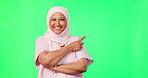 Nurse face, woman pointing and green screen isolated on studio background for islamic healthcare, mockup and presentation. Doctor, medical and muslim person in hijab show space for health insurance