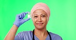 Green screen, doctor and Muslim woman with bottle for medicine, medical treatment and vaccine in studio. Healthcare, chromakey and portrait of female worker for wellness, medication and prescription