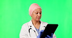 Green screen, tablet and doctor or woman isolated on studio background with analysis, typing or healthcare focus in mockup. Medical, muslim person working on digital tech, app and telehealth research