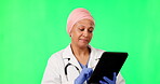 Tablet, woman doctor and green screen isolated on studio background for yes, satisfied and typing healthcare results. Medical, muslim person with research on digital tech, space and telehealth mockup