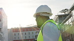 Engineering, helmet and man at outdoor construction site, building development and compliance or inspection. Gear, safety and architecture, contractor or african person with urban design or property