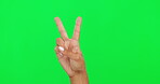 Hands, peace or v sign and a person on green screen for support, emoji or thank you. Hand gesture of a woman to show icon or symbol for freedom, kindness or vote and motivation on a studio background