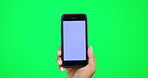 Mockup, hand and a person with a phone on green screen for website, internet or network promo. Hands of a model with a smartphone for online advertising, ux or ui information on a studio background