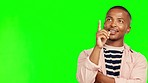 Thinking, pointing up and face of black man on green screen for good news, announcement and promotion. Advertising, marketing and male person with hand gesture on chromakey background for information