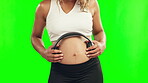 Hands, pregnant woman or headphones on stomach in studio for growth or baby development. Pregnancy music, relax or mother to be streaming radio audio on abdomen for healthy maternity on green screen