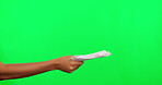 Offer, money and person hand on green screen or studio background for financial loan, payment or bonus. Cash, giving and people in finance, banking and lottery or giveaway, salary and profit increase