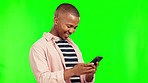 Green screen, smile and black man with a smartphone, typing and connection with mobile app and social media. Male person, Ghana and model with a cellphone, network or happiness on a studio background