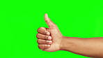 Hands, thumbs up and winning in success on green screen for good job against a studio background. Hand of person in thumb emoji, yes sign or like for win, achievement or approval on mockup space