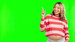 Studio, pointing or happy pregnant woman on green screen for promotion deal, sale offer or announcement. Pregnancy, maternity or mother to be smiling showing mockup space for advertising or marketing