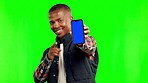 Black man, face and point with phone by green screen for mockup space, app promo and smile with shaka icon. Young African student, gen z guy and smartphone with mock up for logo, brand and blank ux