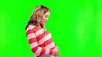 Dancing, pregnant stomach and a happy woman on a green screen with energy, hope and love. Excited female person with happiness and dance for pregnancy health and wellness on a studio background