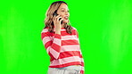 Pregnant, phone call and a happy woman talking on a green screen with a smile. Young female person in pregnancy with a cellphone for communication, chat or health conversation on a studio background