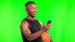 Basketball, funny and black man with phone on green screen in studio isolated on a background mockup. Laugh, mobile and African athlete with ball for workout, training or comedy meme on smartphone.