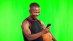 Basketball, winner and black man with phone on green screen in studio isolated on a background mockup. Celebration, mobile and athlete with ball for winning prize, success or excited for funny sports