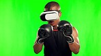 Man, boxing and virtual reality, gaming and green screen with fitness, video game and futuristic tech on studio background. Male gamer, VR goggles and boxer with esport experience and mockup space