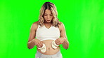 Baby shoes, happy and pregnant woman playing on green screen walking on belly for growth or development. Pregnancy, excited and mother with socks for love, happiness or healthy baby announcement