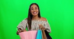 Happy woman, shopping bag and fashion on green screen for gifts or ecommerce against a studio background. Excited female person, customer or shopper smile and luxury bags for purchase on mockup space