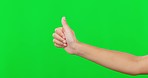 Hands, thumbs up and approval on green screen for winning against a studio background. Hand of child or kid with thumb emoji, yes sign or like for win, good job or success in achievement on mockup