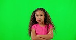 Fashion, face and kid in studio with green screen posing in casual, trendy and stylish children outfit. Confident, sweet and portrait of girl model with crossed arms isolated by chromakey background.